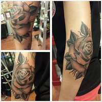 Black-And-Grey-Traditional-Rose-Tattoo-On-Elbow.jpg