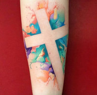 Crucifix-on-Negative-Space-of-a-Watercolor-Splash-Forearm-Tattoo.jpg