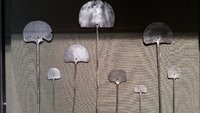 1920px-Silver_tupus_collected_on_Bingham's_1912_expedition_to_Macchu_Picchu.jpg