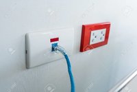 88855207-internet-blue-cable-plug-into-the-white-network-outlet-against-white-wall.jpg