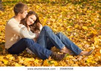 stock-photo-happy-young-couple-in-love-meeting-on-the-autumn-leaf-35680558.jpg