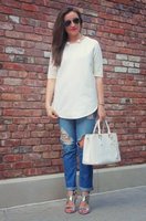 white-tunic-blouse-with-blue-ripped-cuffed-jeans-and-silver-sandals.jpg