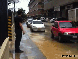 1369936482_guy_takes_cab_to_cross_puddle.gif