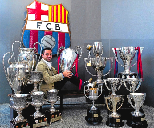 Xavi-and-trophies-fc-barcelona-22616574-500-416.jpg